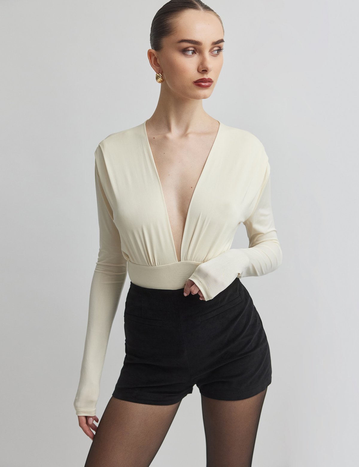 Γυναικείο μακρυμάνικο κορμάκι με ντεκολτέ V