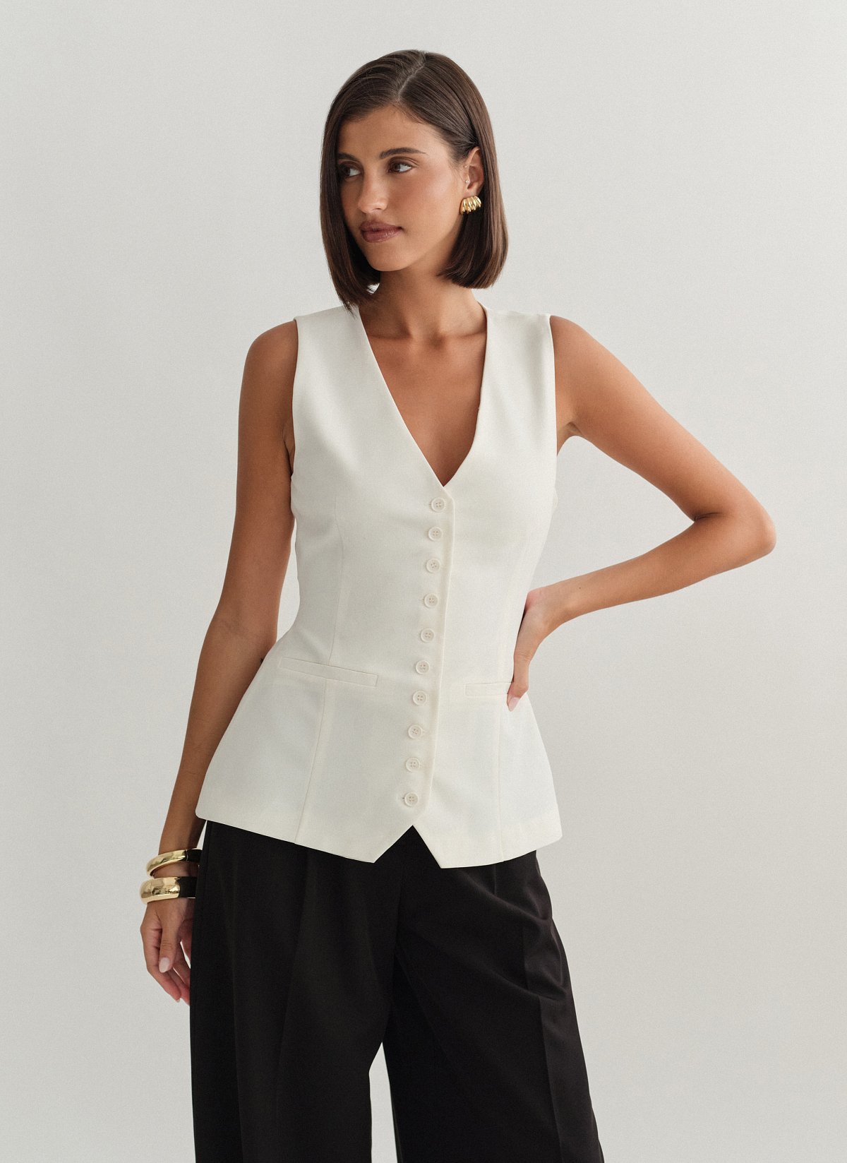 Γυναικείο μεσάτο υφασμάτινο γιλέκο με κουμπιά