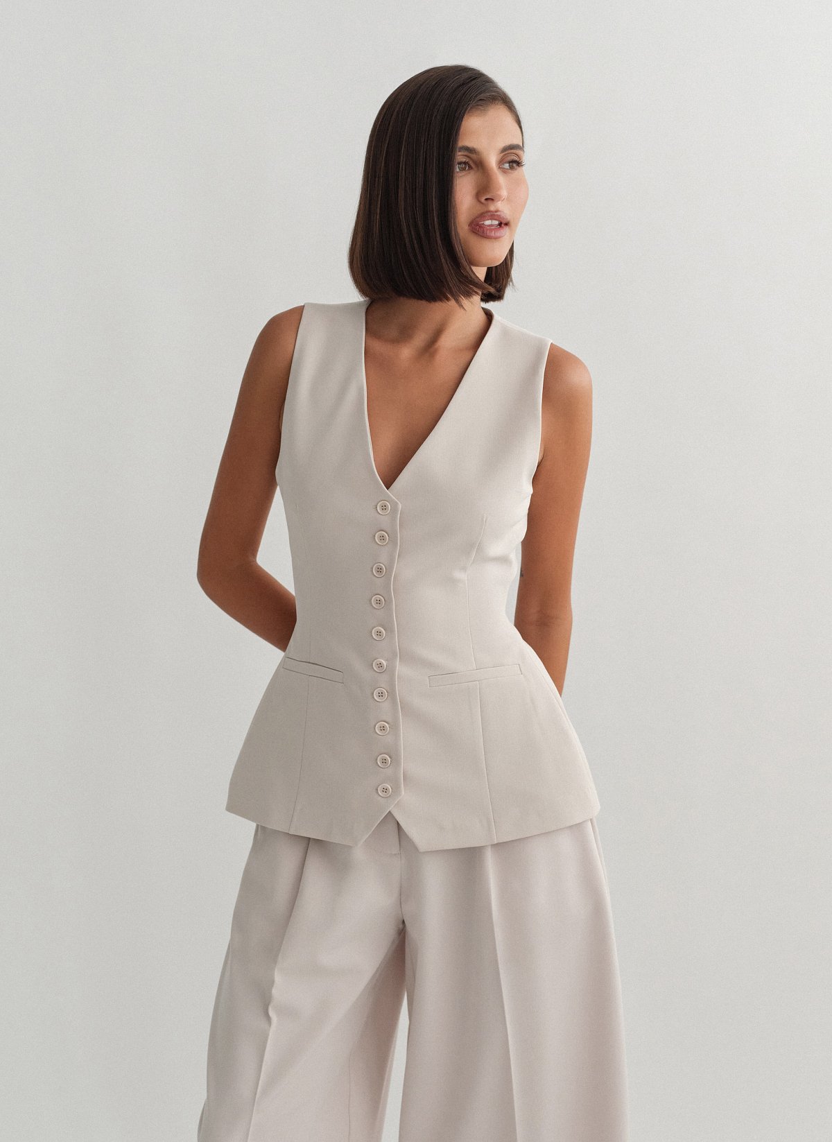 Γυναικείο μεσάτο υφασμάτινο γιλέκο με κουμπιά