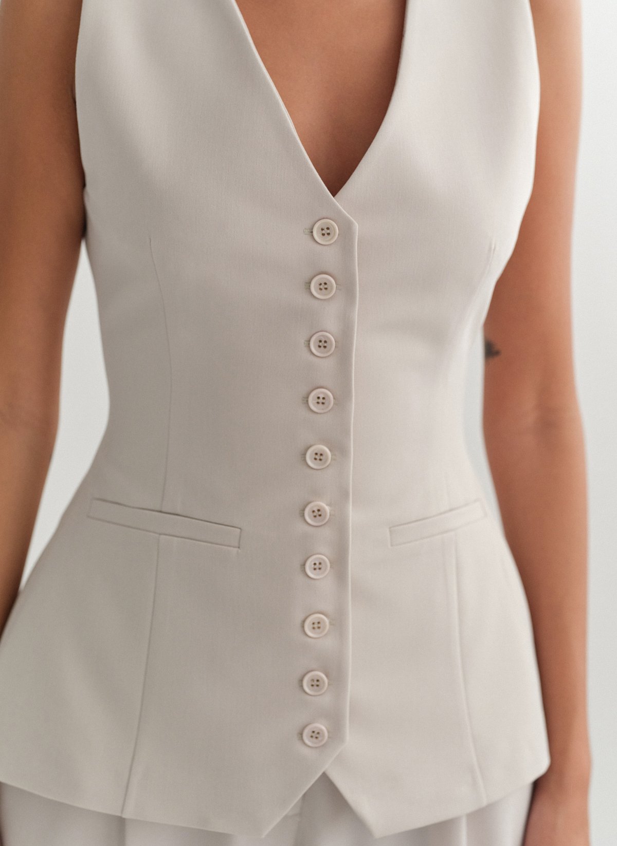 Γυναικείο μεσάτο υφασμάτινο γιλέκο με κουμπιά