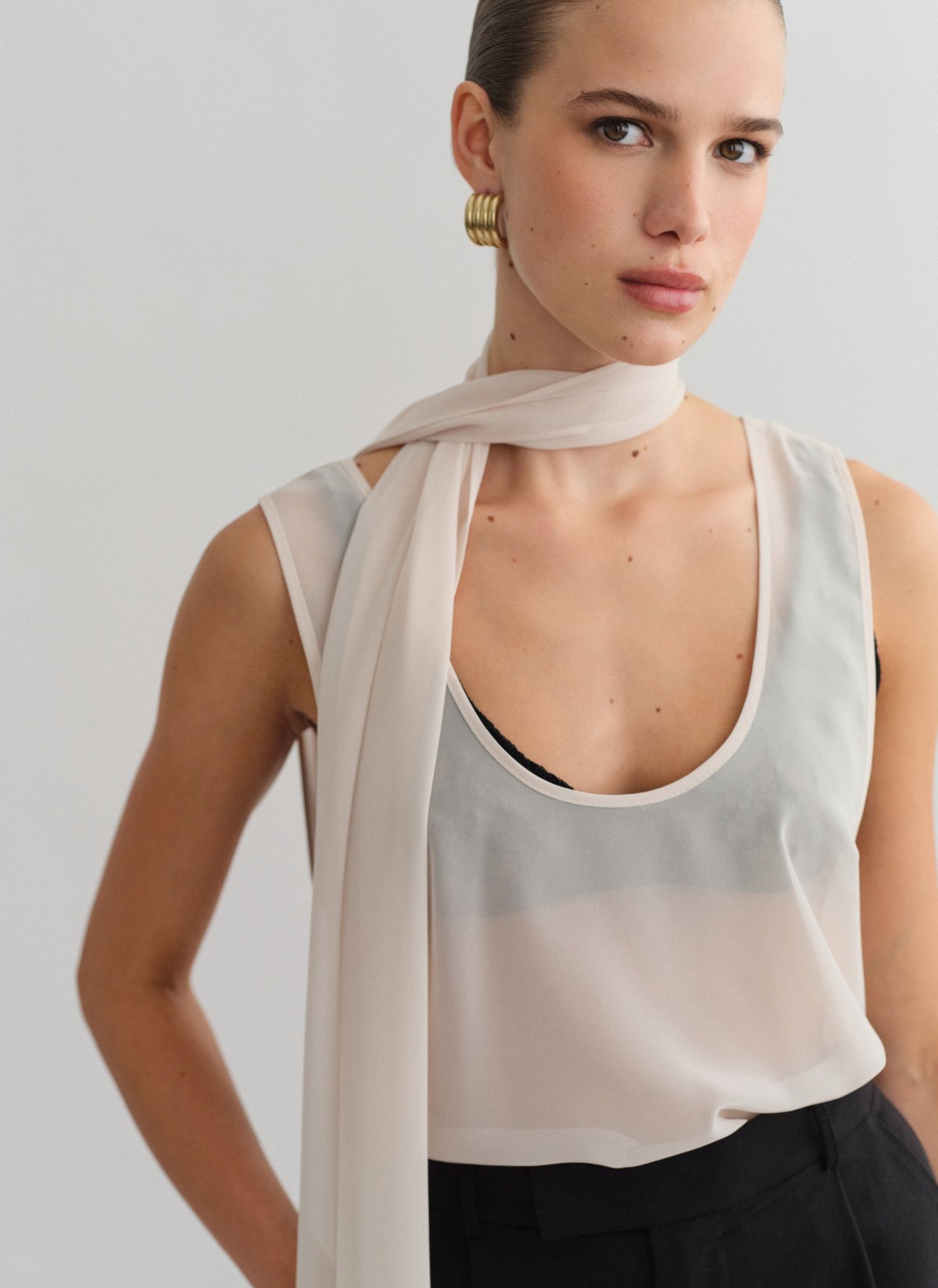 Semi-sheer sleeveless blouse-9