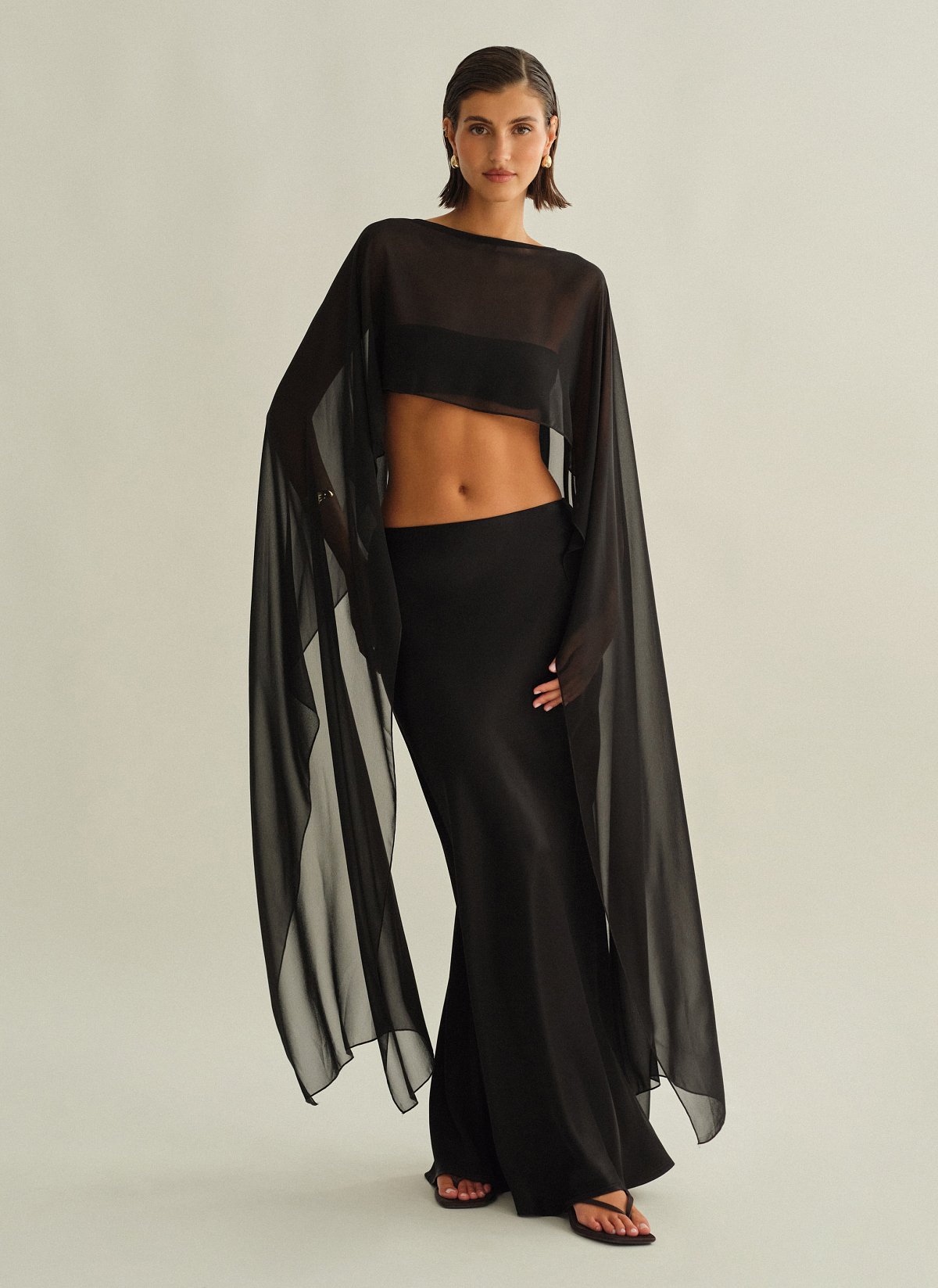 Γυναικεία ασύμμετρη ημιδιάφανη κάπα