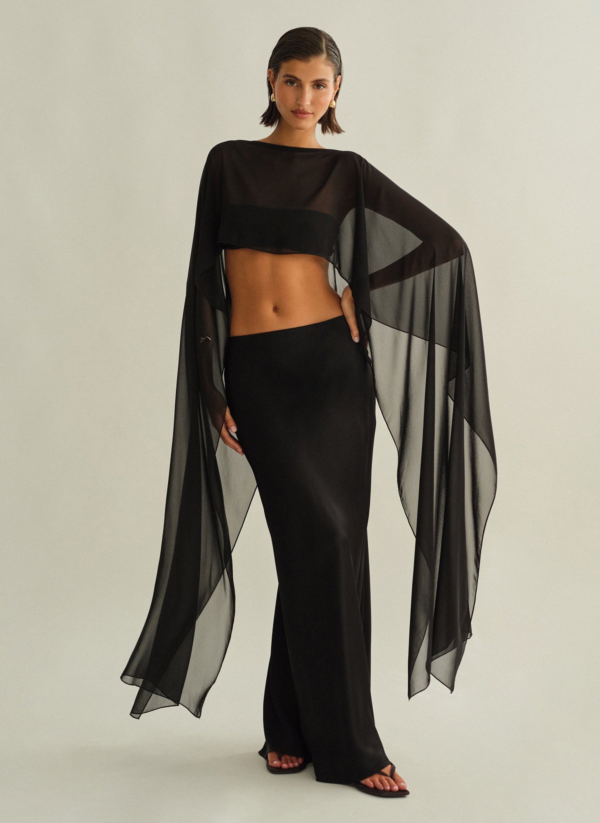 Γυναικεία ασύμμετρη ημιδιάφανη κάπα