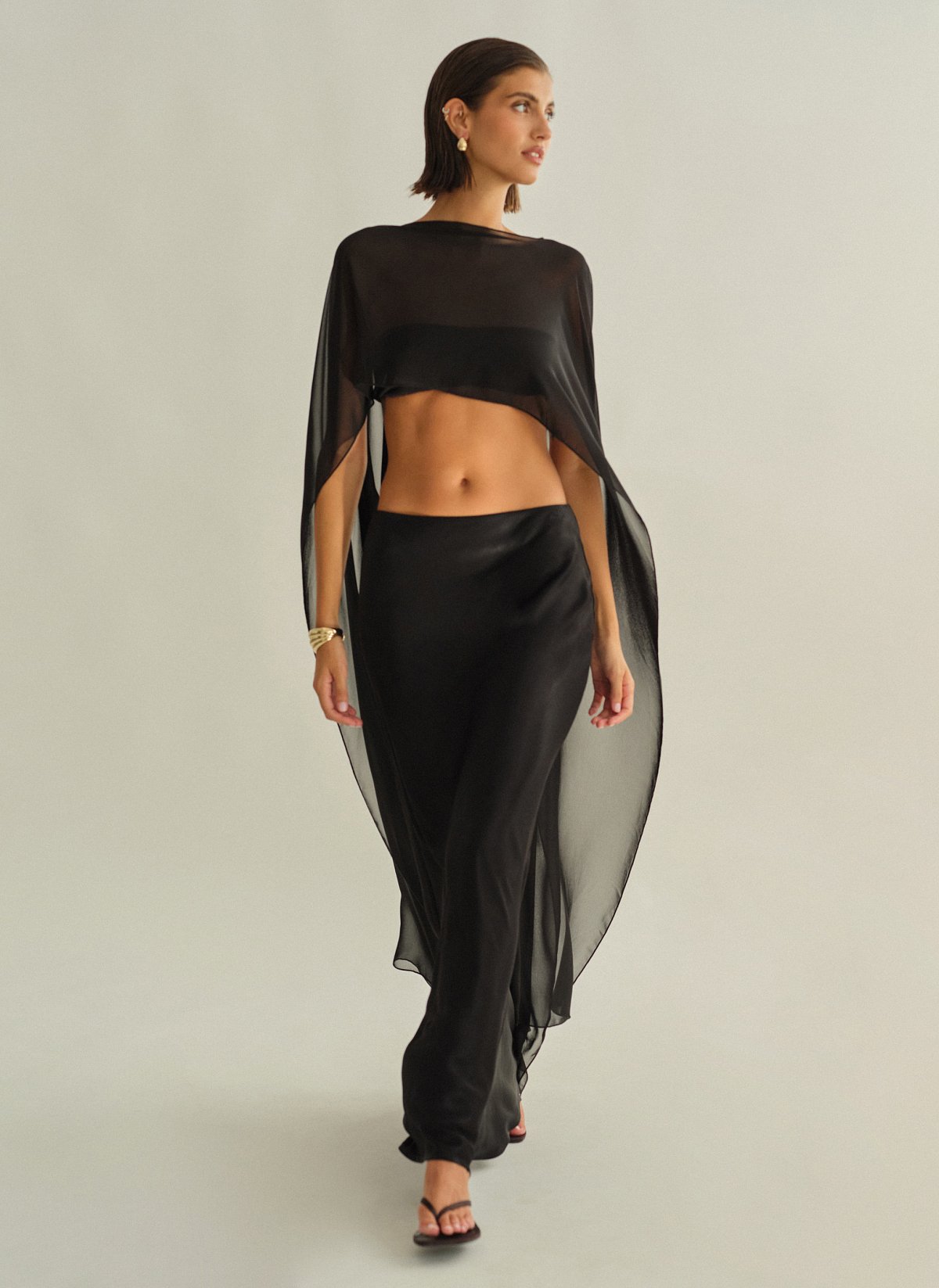 Γυναικεία ασύμμετρη ημιδιάφανη κάπα