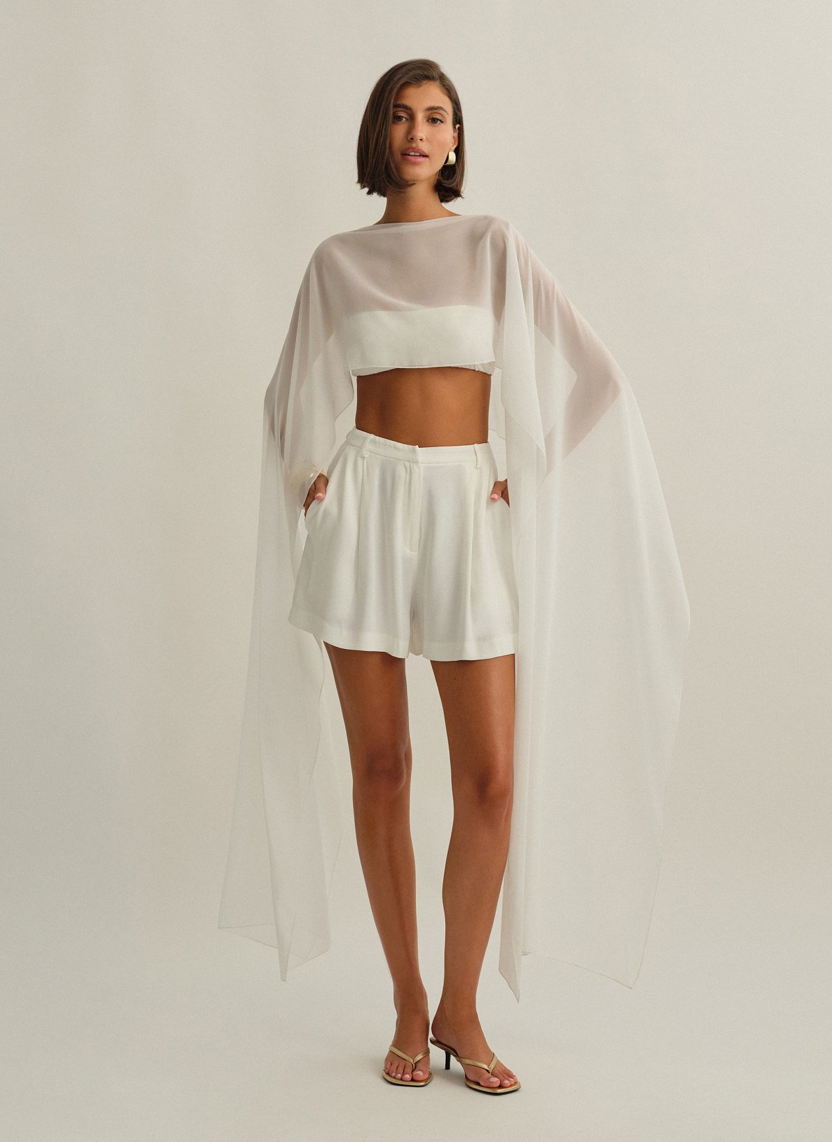 Γυναικεία ασύμμετρη ημιδιάφανη κάπα