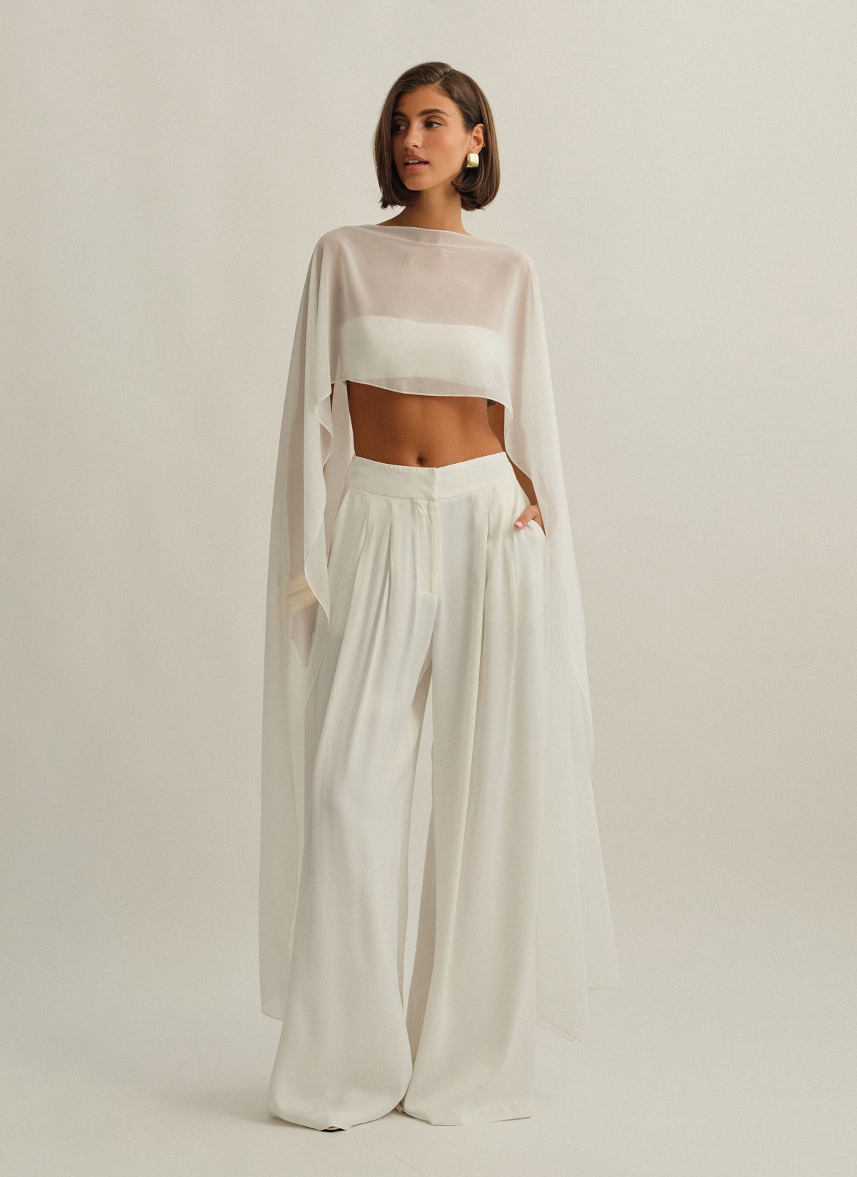 Γυναικεία ασύμμετρη ημιδιάφανη κάπα