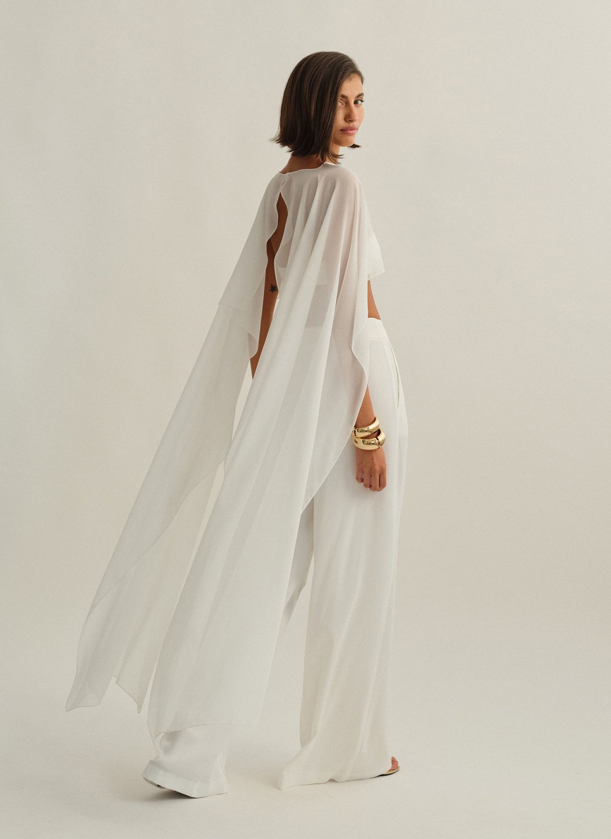 Γυναικεία ασύμμετρη ημιδιάφανη κάπα