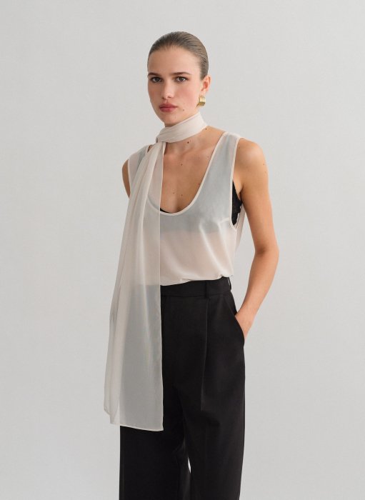 Product: Semi-sheer sleeveless blouse