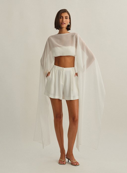 Γυναικεία ασύμμετρη ημιδιάφανη κάπα